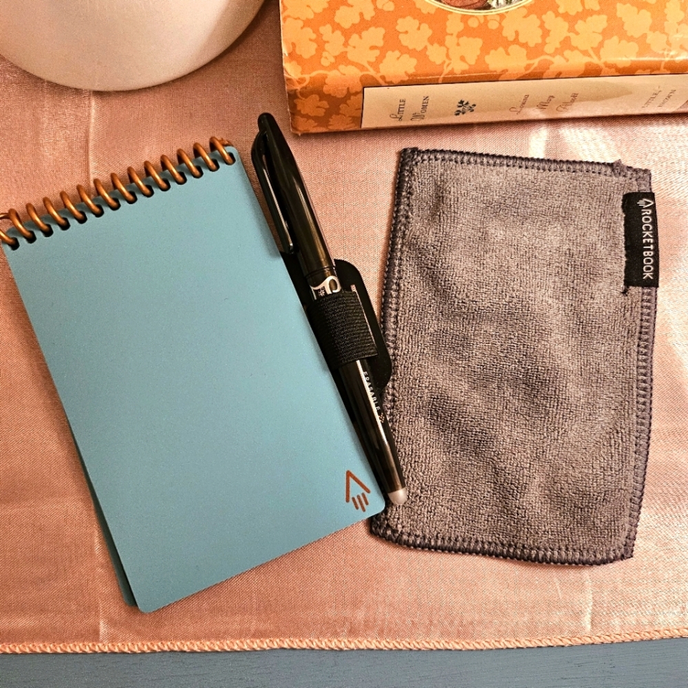 Rocketbook Mini Smart Reusable Notebook with pen, pen loop, and cloth